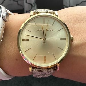 Michael Kors gold tone and leather watch.